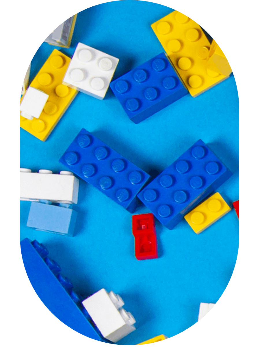 Spread colorful legos on the blue background